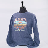 Grey crewneck sweatshirt with a colorful view of an Alberta mountain range with canola and Alberta wild roses. 