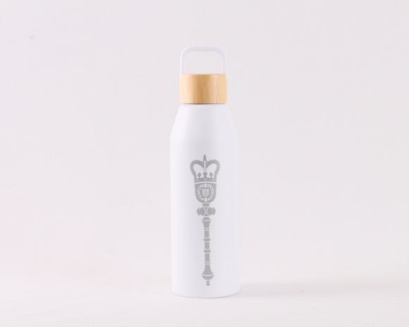 White water bottle with a brown bamboo screw top lid, with a gray laser engraved Alberta Mace on the front.