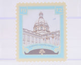 Stylized illustration of a building with decorative elements on a light blue background