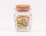  A glass jar with a cork lid containing vegetable pasta soup mix. The label reads: "VEGETABLE PASTA SOUP MIX / Mélange à soupe de légumes et pâtes / HANDMADE IN ALBERTA."